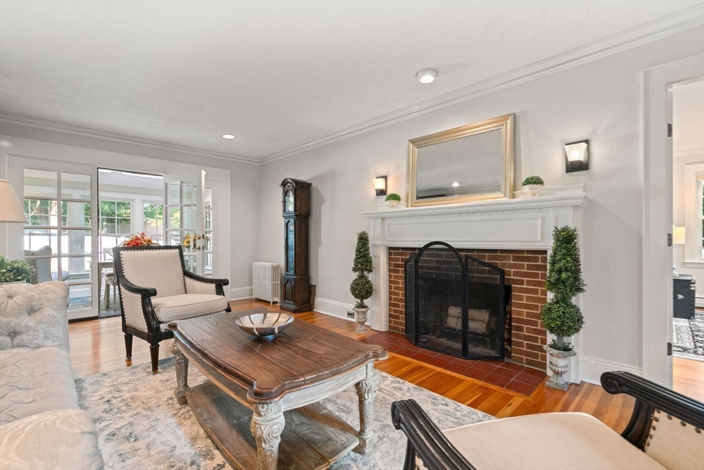 26 Larch Road Newton, MA 02468 - Photo 9 of 34 a living room with furniture and a fireplace