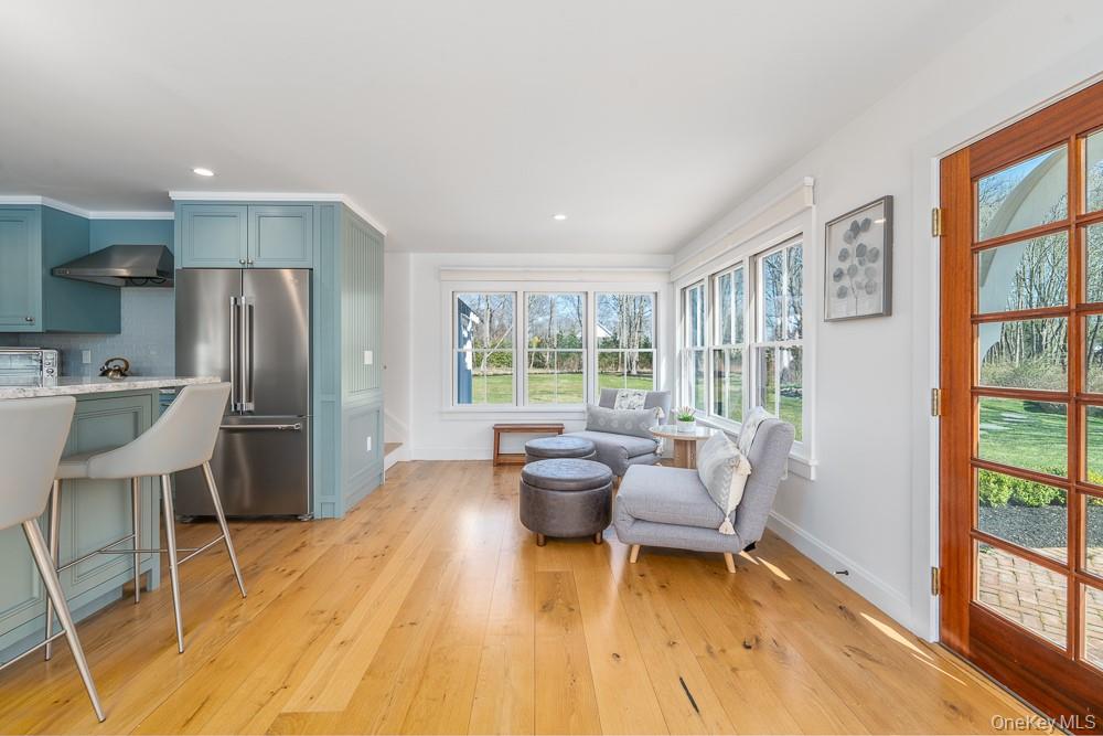 19000 Main Road Mattituck, NY 11952 - Photo 11 of 32 a living room with furniture and a large window