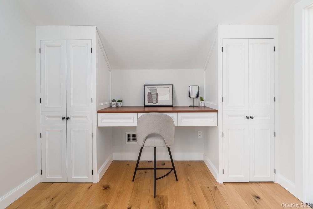 19000 Main Road Mattituck, NY 11952 - Photo 20 of 32 a room with a sink and a mirror