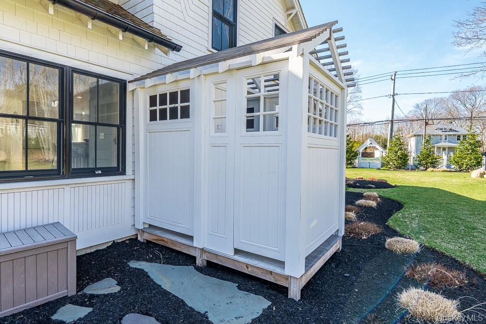 19000 Main Road Mattituck, NY 11952 - Photo 31 of 32 a view of a porch with a yard