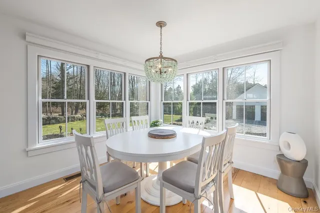 a view of a dining room with furniture window and outside view