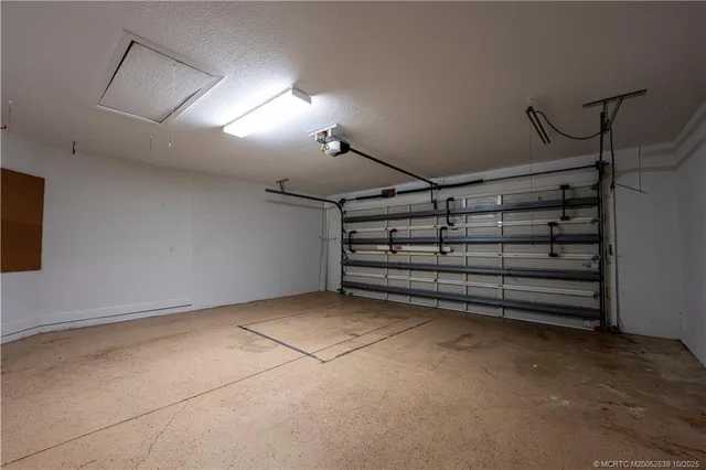 an aerial view of residential houses with outdoor space and swimming pool