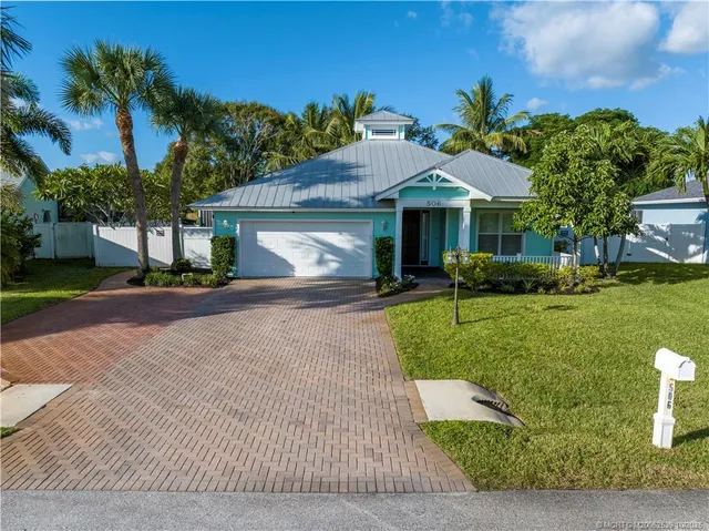 a view of house along with deck and patio