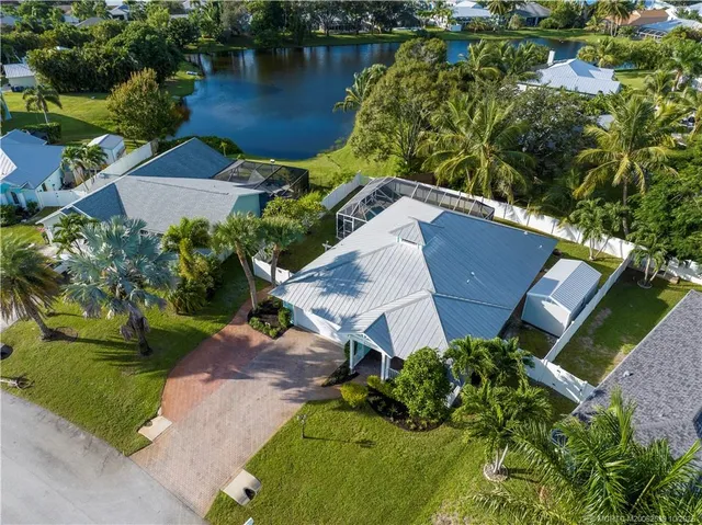 a view of house with a yard