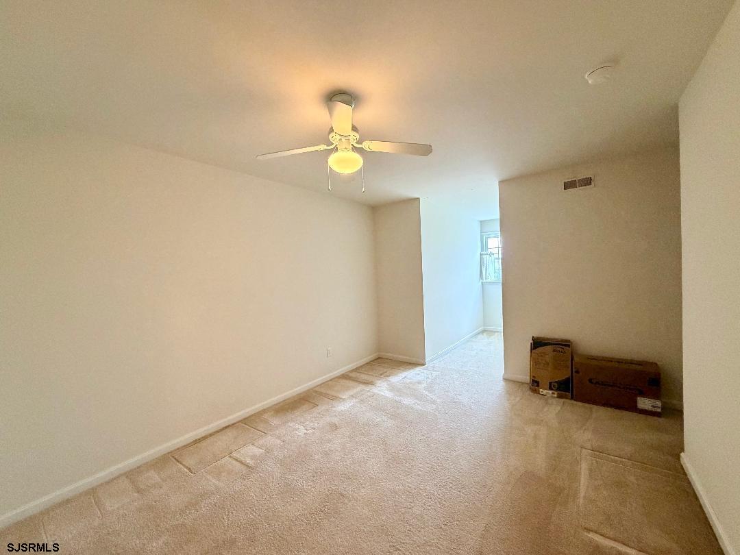 1731 Highway 9, Unit 11 Ocean View, NJ 08230 - Photo 11 of 25 a view of a livingroom with a chandelier fan and a chandelier fan