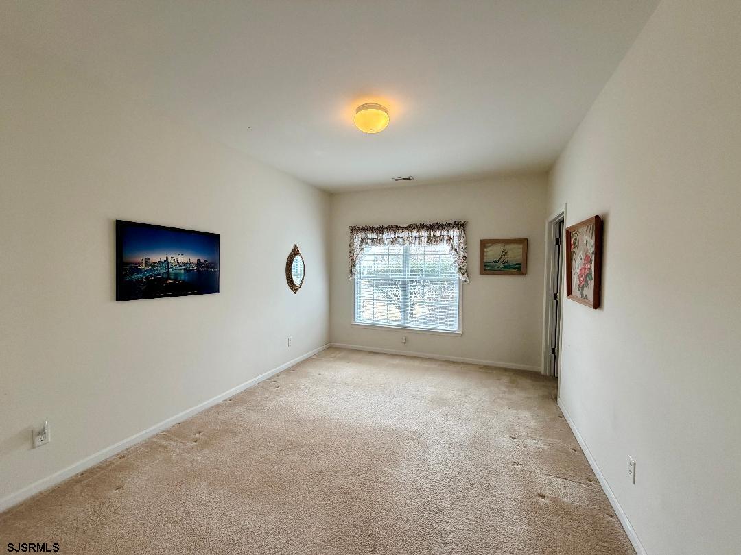 1731 Highway 9, Unit 11 Ocean View, NJ 08230 - Photo 12 of 25 a view of an empty room with a window
