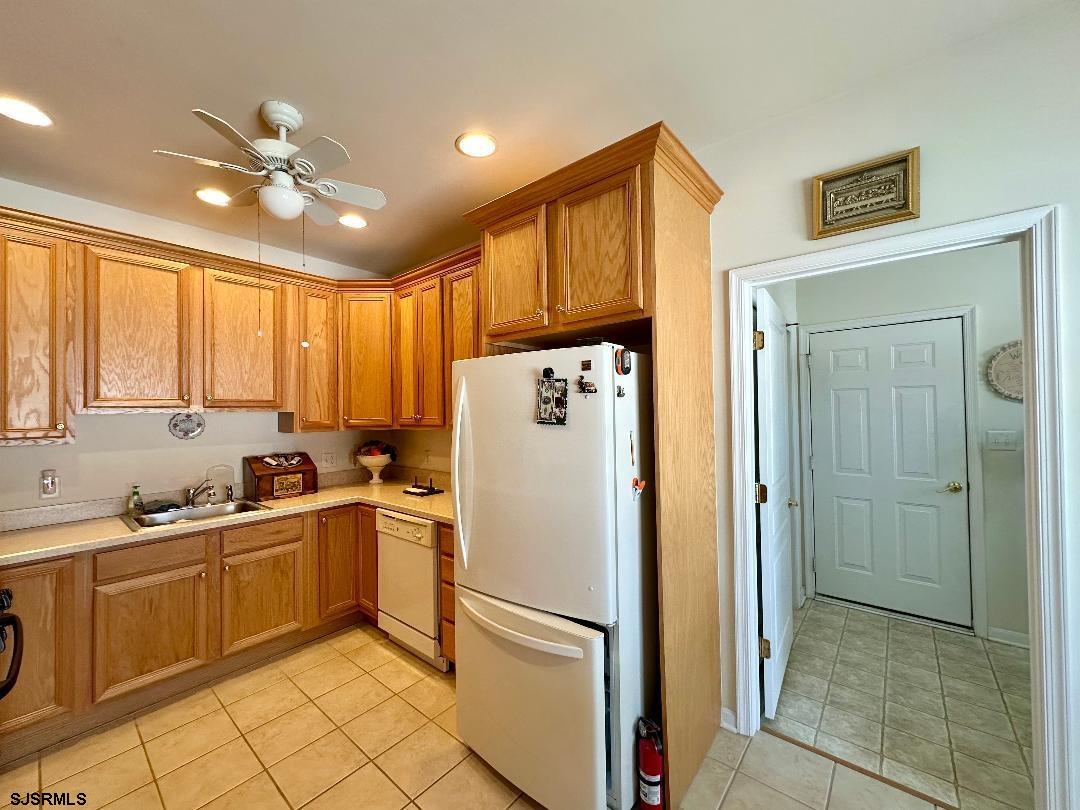 1731 Highway 9, Unit 11 Ocean View, NJ 08230 - Photo 15 of 25 a kitchen with a refrigerator a sink and dishwasher