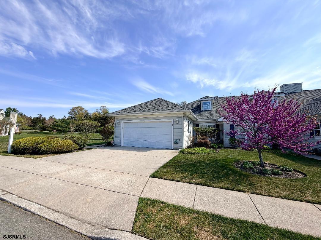 1731 Highway 9, Unit 11 Ocean View, NJ 08230 - Photo 16 of 25 a front view of a house with a yard and garage