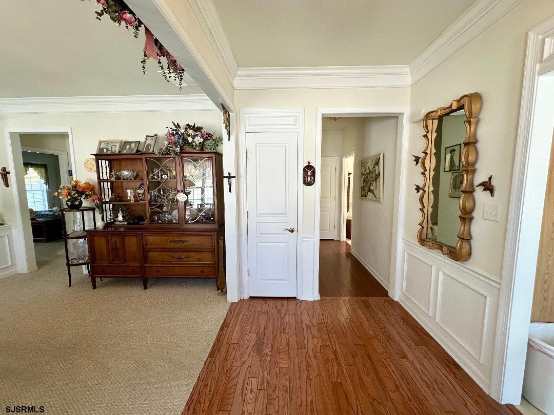 1731 Highway 9, Unit 11 Ocean View, NJ 08230 - Photo 3 of 25 a view of hallway with furniture and wooden floor
