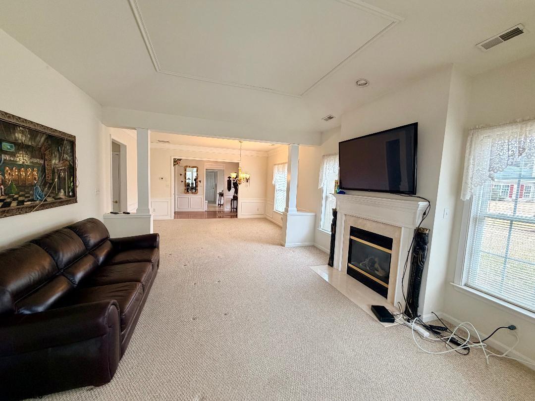 1731 Highway 9, Unit 11 Ocean View, NJ 08230 - Photo 5 of 25 a living room with furniture a flat screen tv and a fireplace