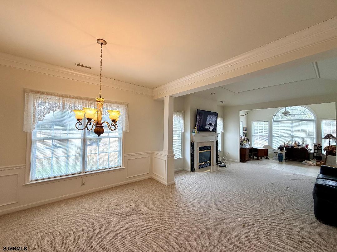 1731 Highway 9, Unit 11 Ocean View, NJ 08230 - Photo 6 of 25 a view of a livingroom with furniture and a chandelier