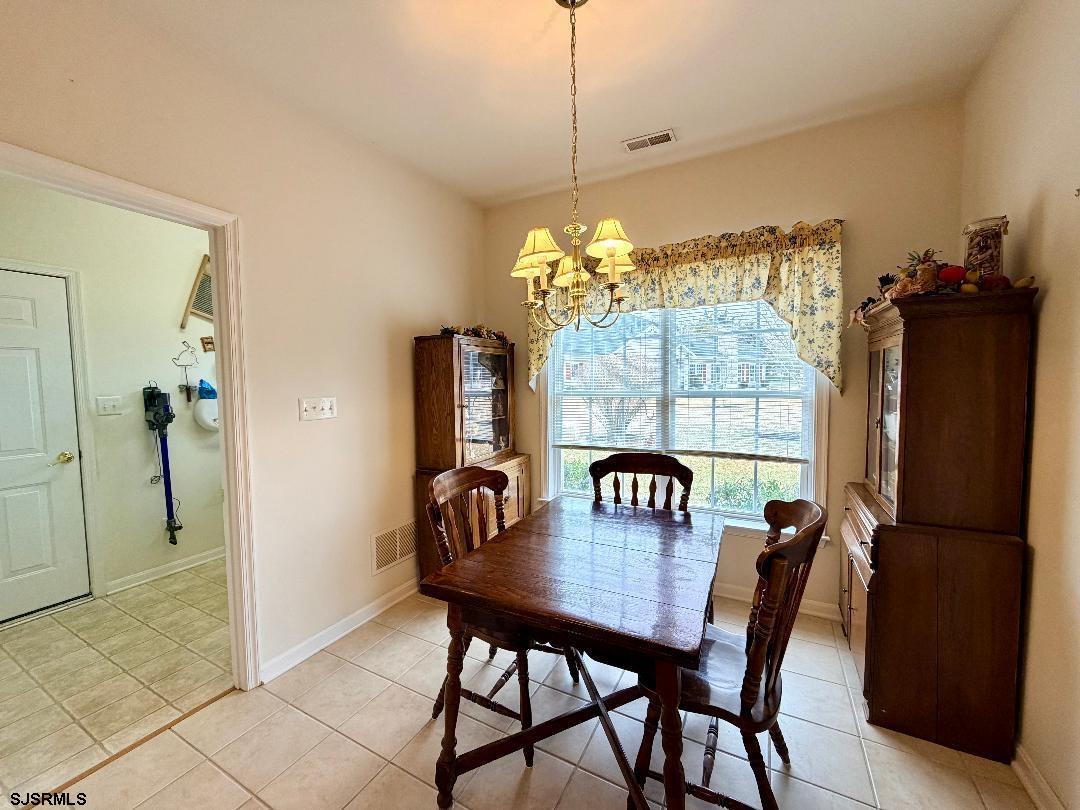 1731 Highway 9, Unit 11 Ocean View, NJ 08230 - Photo 8 of 25 a view of a dining room with furniture and window