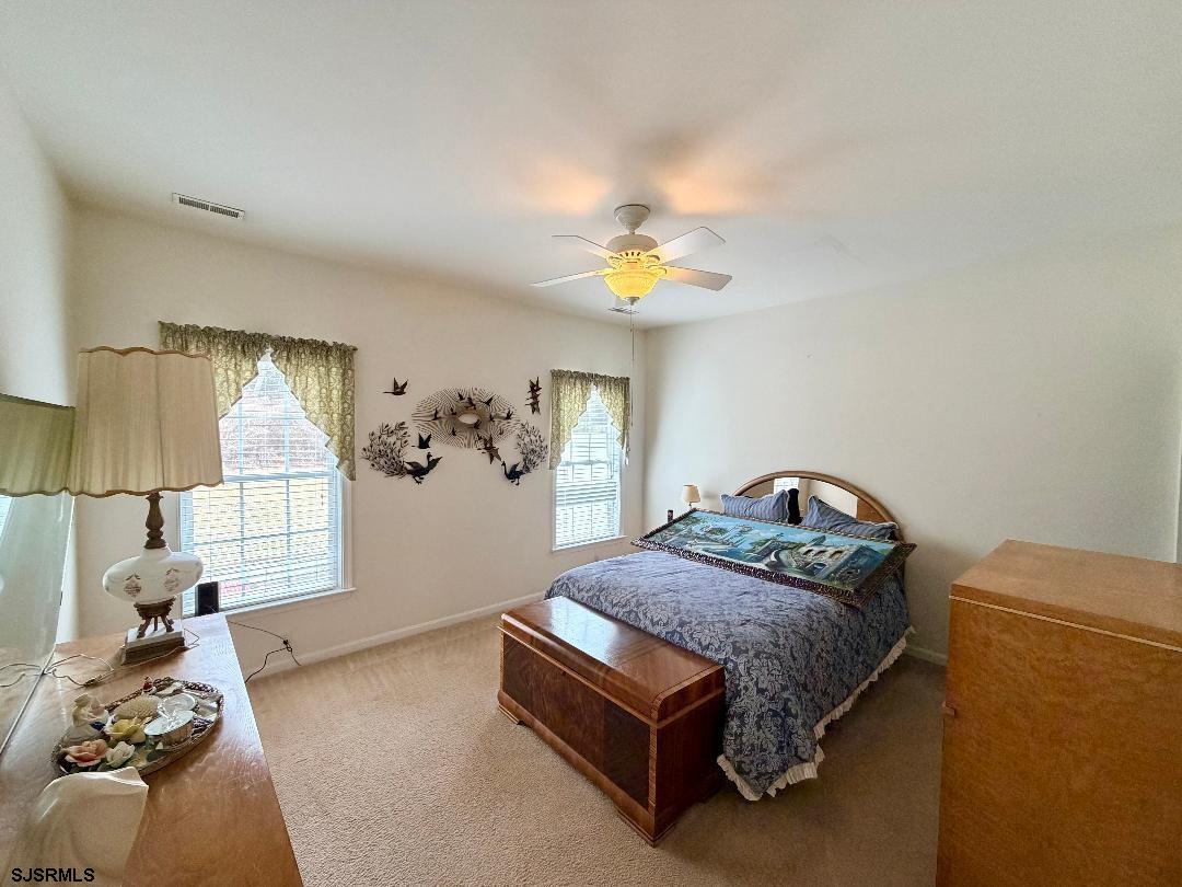 1731 Highway 9, Unit 11 Ocean View, NJ 08230 - Photo 10 of 25 a bedroom with a bed and a window