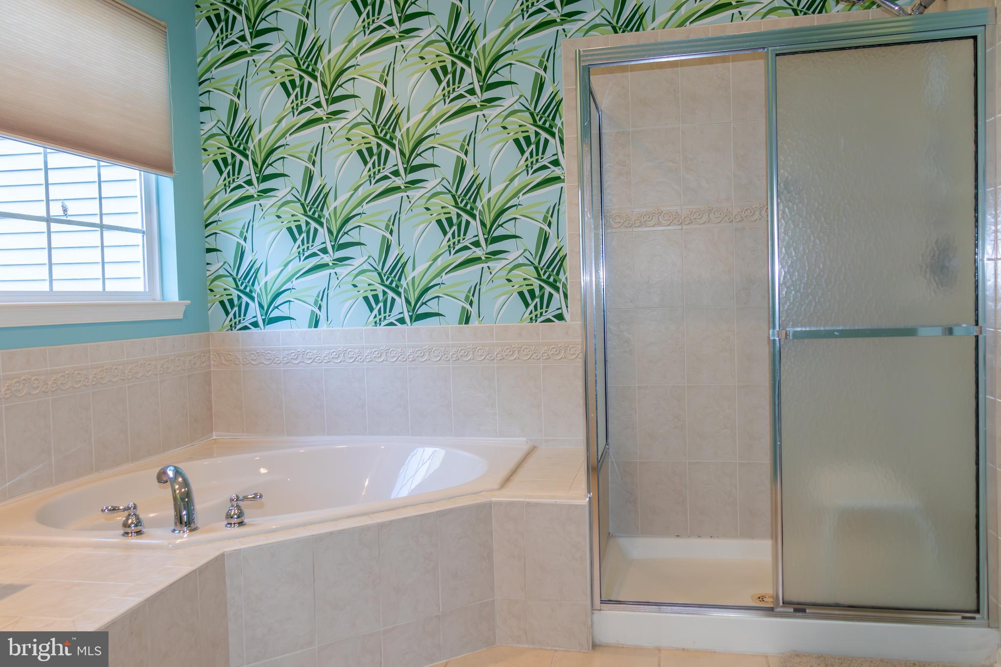 43 Chickadee Way Hamilton, NJ 08690 - Photo 23 of 36 a bathroom with a bathtub and a shower