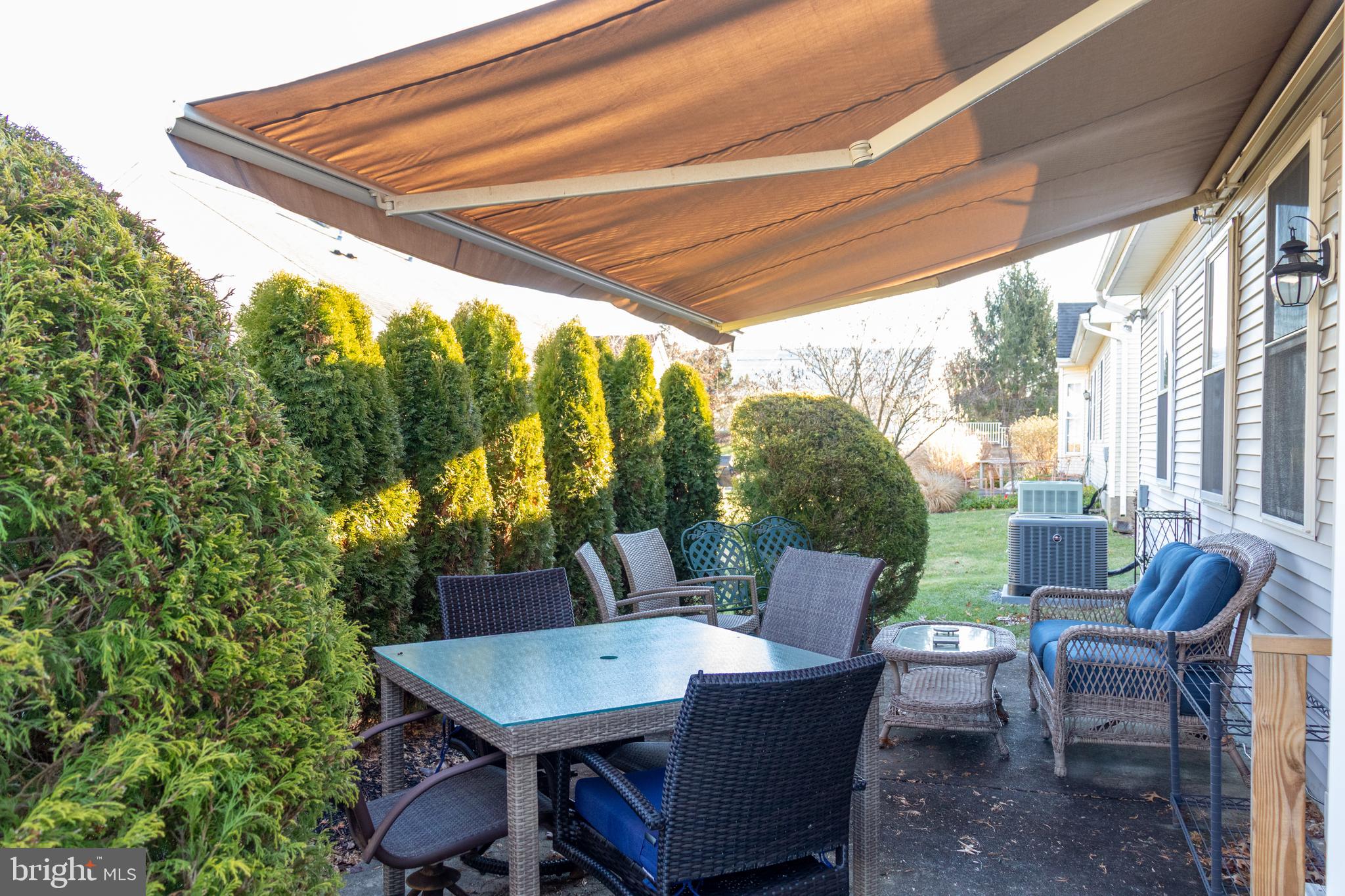 43 Chickadee Way Hamilton, NJ 08690 - Photo 34 of 36 a patio with a table and chairs and potted plants