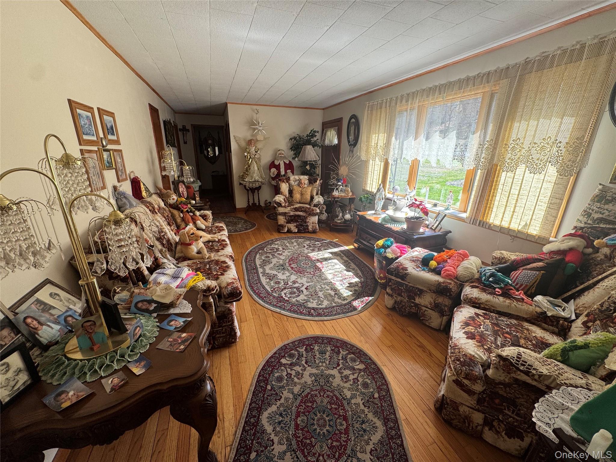 367 Mt Eve Road Goshen, NY 10924 - Photo 19 of 37 a living room with furniture and a floor to ceiling window