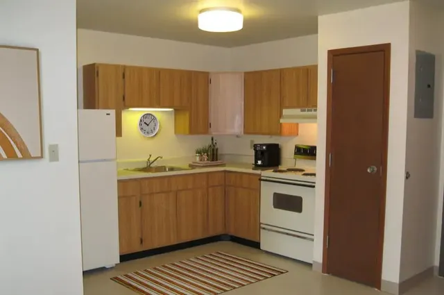 a kitchen with a sink and cabinets