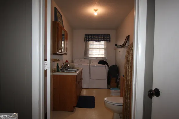 a bathroom with a toilet and a sink