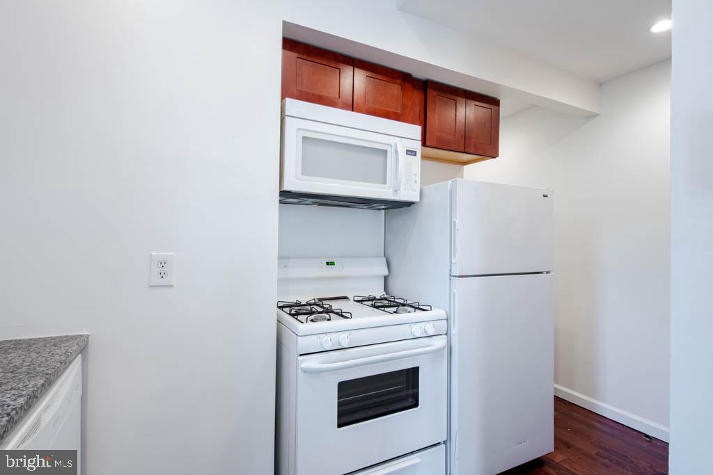 545 Christian Street, Unit 2 Philadelphia, PA 19147 - Photo 11 of 30 a kitchen with a stove and a microwave