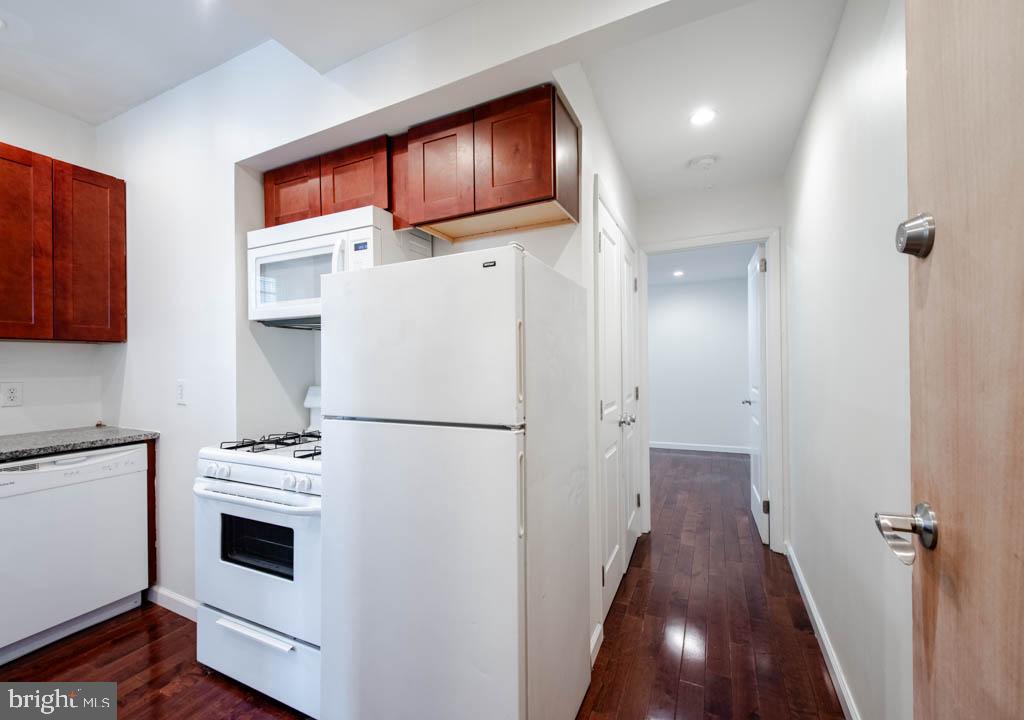545 Christian Street, Unit 2 Philadelphia, PA 19147 - Photo 14 of 30 a kitchen with a refrigerator a sink and cabinets