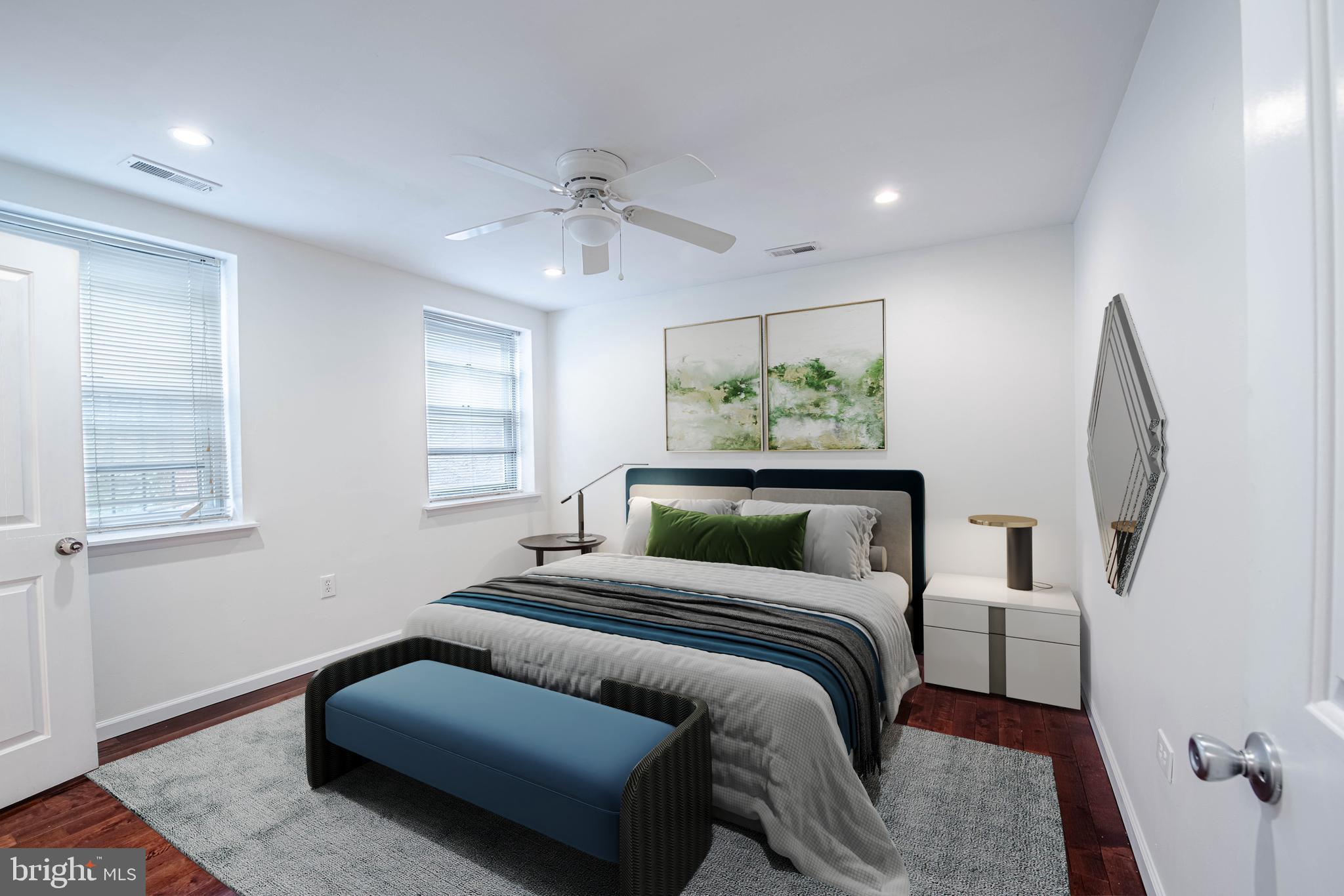 545 Christian Street, Unit 2 Philadelphia, PA 19147 - Photo 2 of 30 a bedroom with a large bed and a chandelier