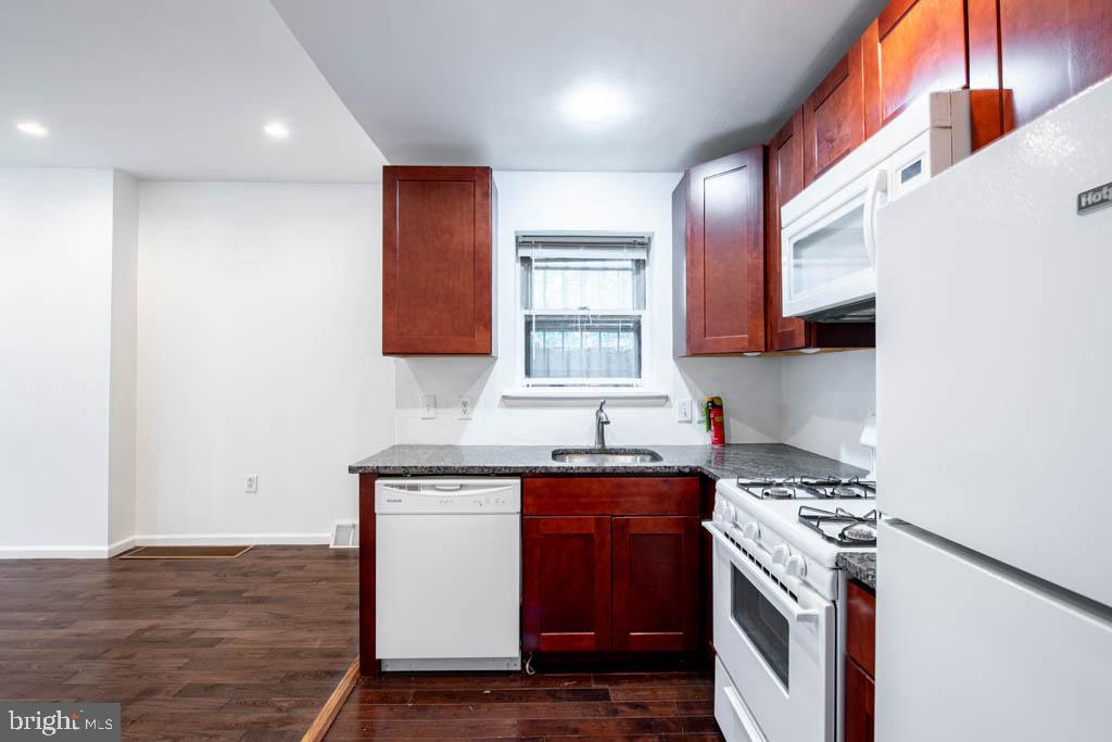 545 Christian Street, Unit 2 Philadelphia, PA 19147 - Photo 22 of 30 a kitchen with a sink stove and microwave