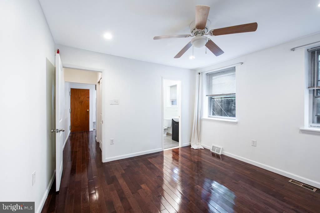 545 Christian Street, Unit 2 Philadelphia, PA 19147 - Photo 23 of 30 a view of empty room with wooden floor and ceiling fan
