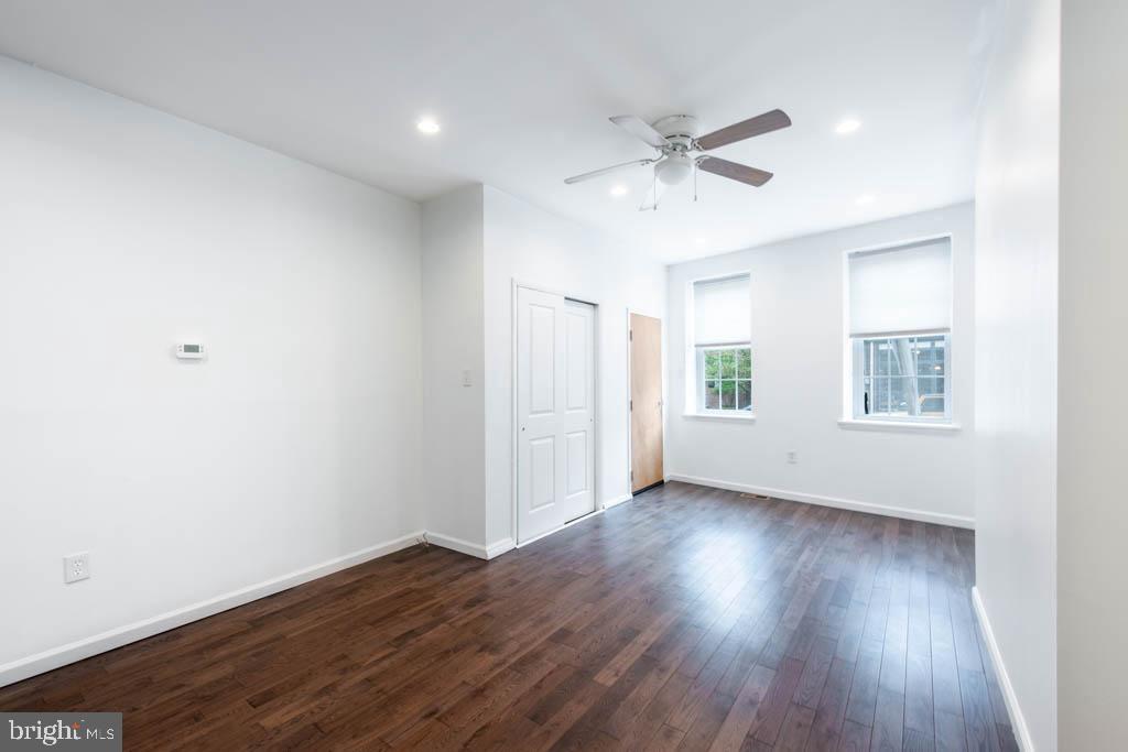 545 Christian Street, Unit 2 Philadelphia, PA 19147 - Photo 26 of 30 a view of an empty room with wooden floor and a window