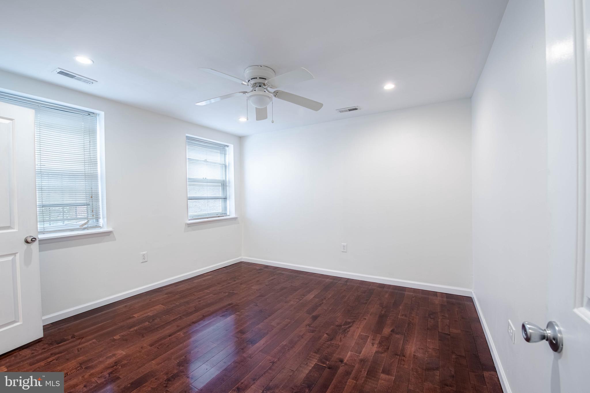 545 Christian Street, Unit 2 Philadelphia, PA 19147 - Photo 4 of 30 wooden floor in an empty room with a window