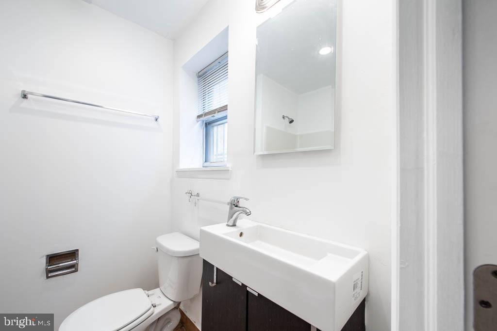 545 Christian Street, Unit 2 Philadelphia, PA 19147 - Photo 7 of 30 a bathroom with a sink toilet and vanity