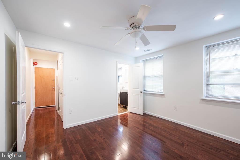 545 Christian Street, Unit 2 Philadelphia, PA 19147 - Photo 8 of 30 a view of an empty room with wooden floor and a window