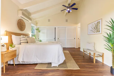 a bedroom with a bed and cabinets