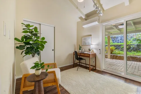a workspace with furniture and a potted plant