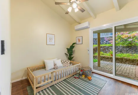 a bed room with furniture and a window