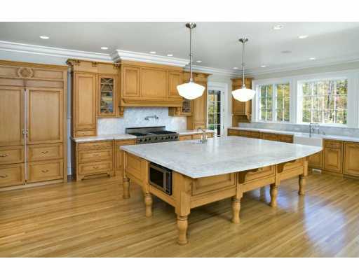 Undisclosed Address Greenwich, CT 06830 - Photo 4 of 7 a kitchen with a table chairs and wooden floor