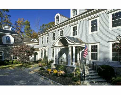 Undisclosed Address Greenwich, CT 06830 - Photo 7 of 7 a front view of a house with a yard
