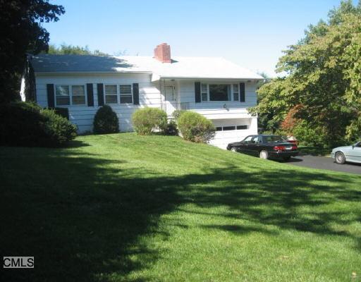 35 Blue Hills Road Monroe, CT 06468 - Photo 1 of 1 a front view of a house with a garden