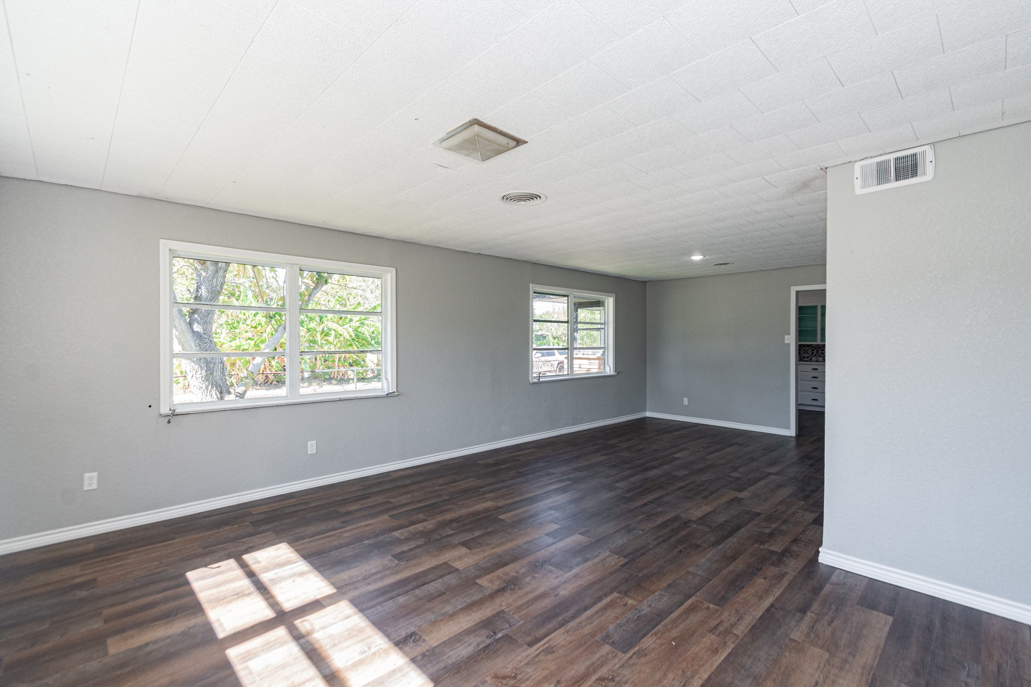 1230 West 4th Street Freeport, TX 77541 - Photo 7 of 49 Laminate Floors. Living and Dining areas.