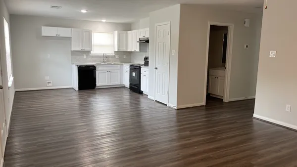 a view of kitchen and wooden floor