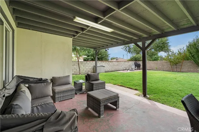 a patio with yard table and chairs