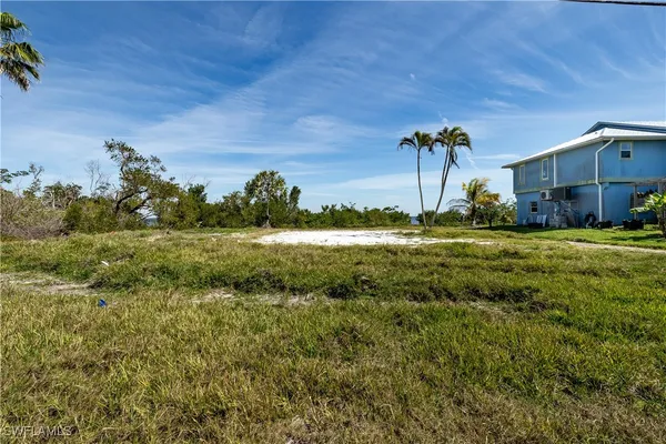 a view of a lake with a big yard