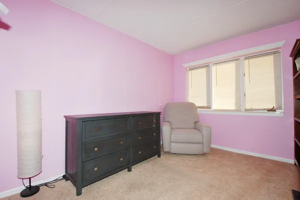 a living room with furniture and window