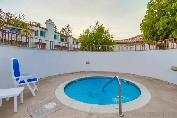 a view of swimming pool with seating space