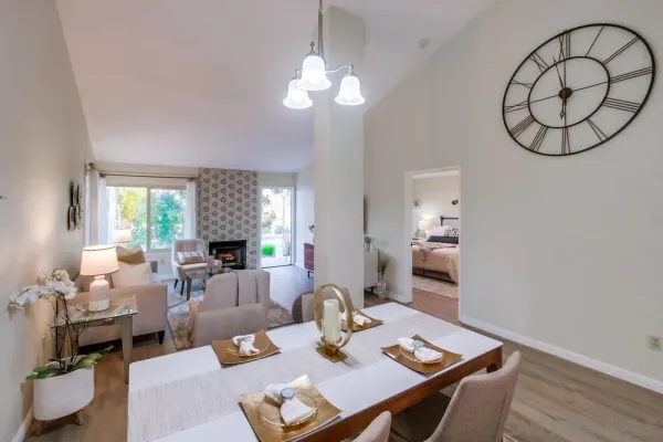 a living room with furniture a window and a chandelier