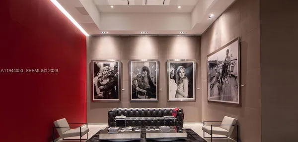 a living room filled with furniture and a flat screen tv