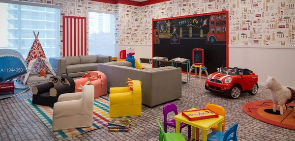 a living room with furniture and a floor to ceiling window