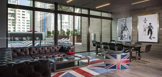 a room with gym equipment and view of living room