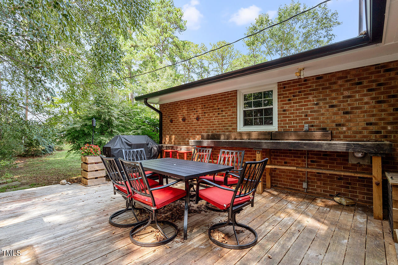 1660 Benson Road Angier, NC 27501 - Photo 29 of 32 a view of backyard with seating space and trees