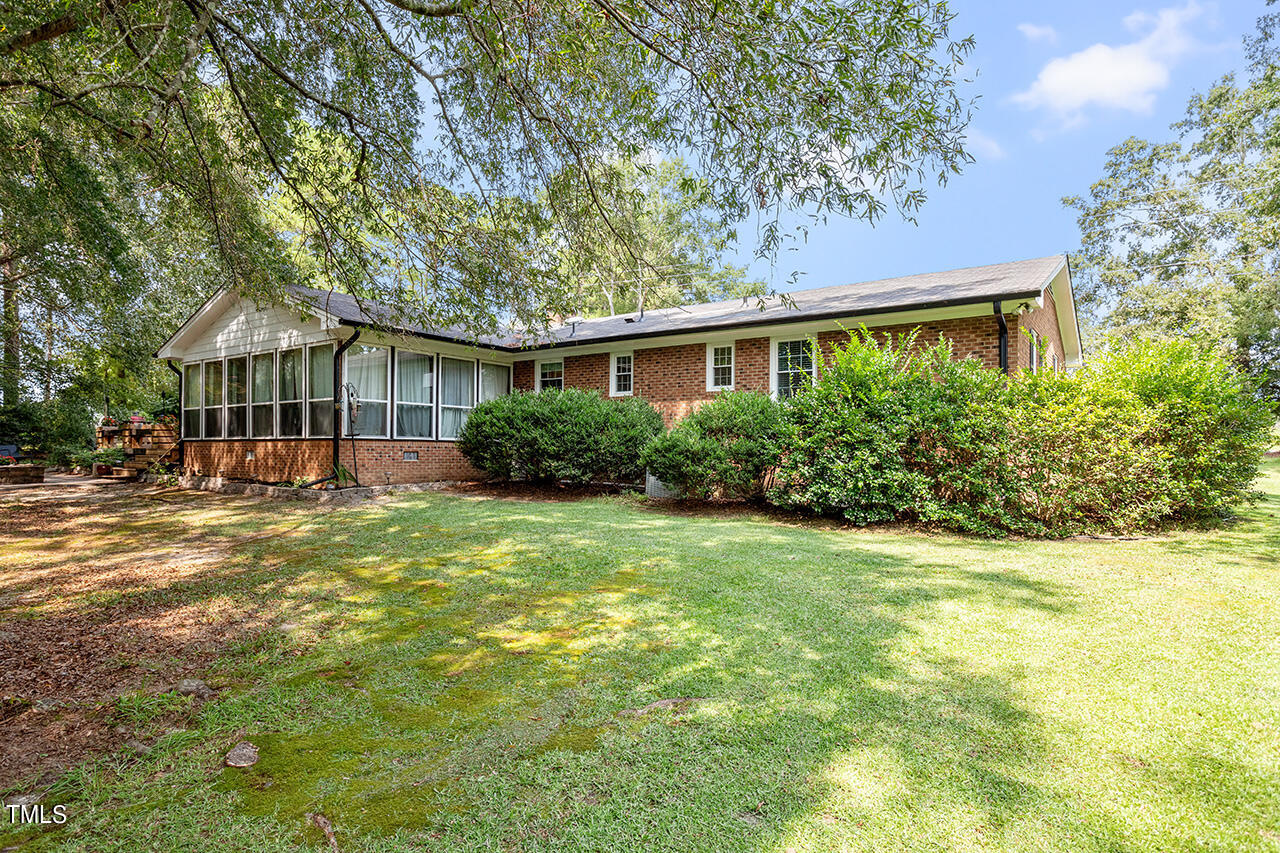 1660 Benson Road Angier, NC 27501 - Photo 31 of 32 a front view of house with yard and green space