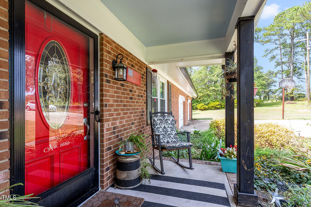1660 Benson Road Angier, NC 27501 - Photo 5 of 32 a view of front door with outdoor seating
